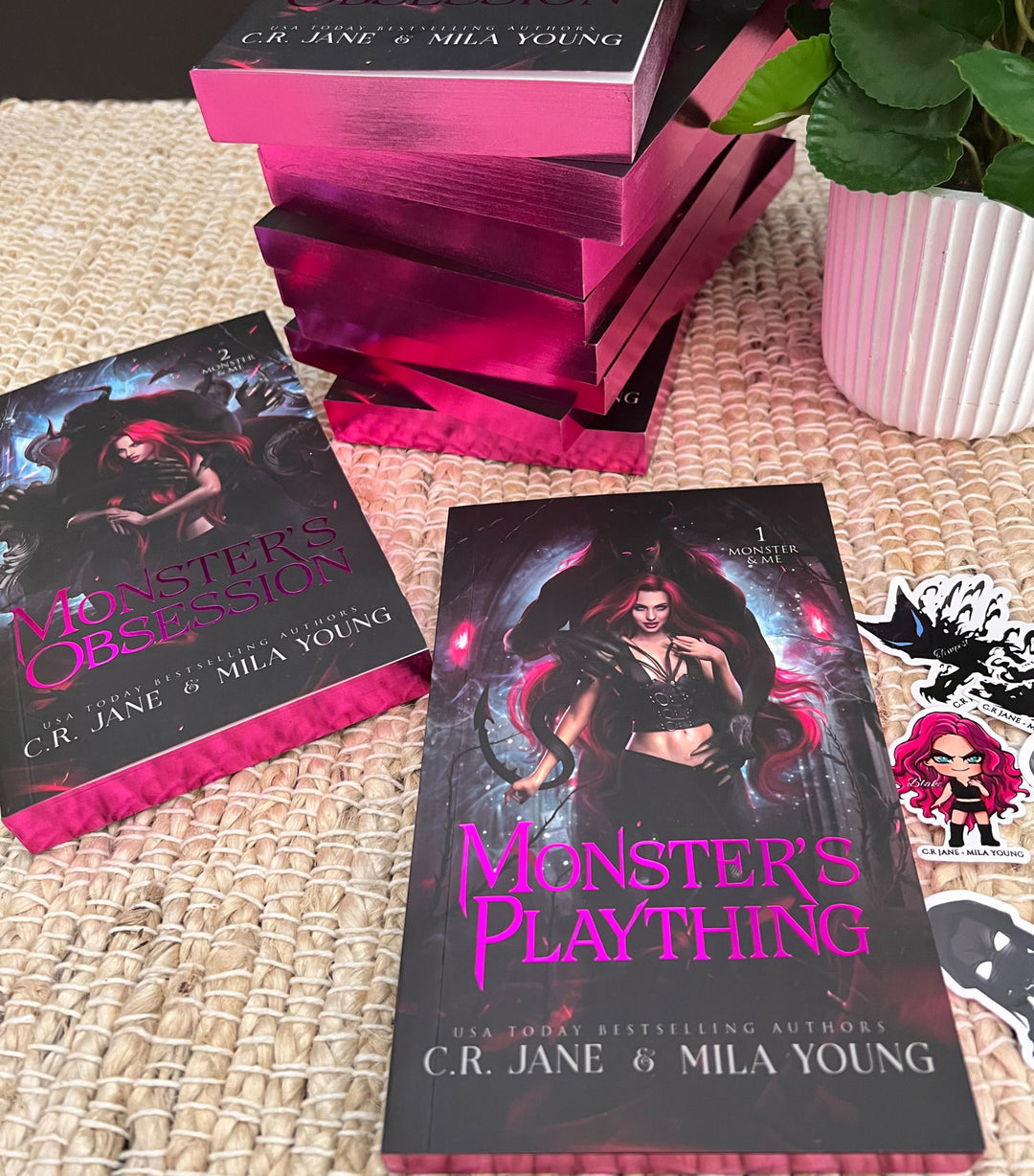 DAMAGED BOOK - Monster's Plaything and Monster's Obsession Duet, a discounted product with minor damage, not eligible for refunds or returns, featuring a story of a woman pursued by monsters in her dreams, who becomes their favorite plaything