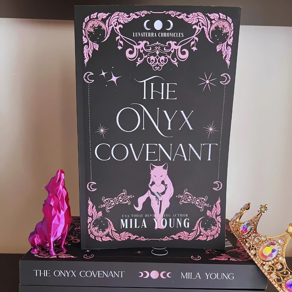   
A dark cover featuring the title *NEW* The Onyx Covenant Paperback with shadowy wolf shifters and mystical symbols representing forbidden love and deadly magic