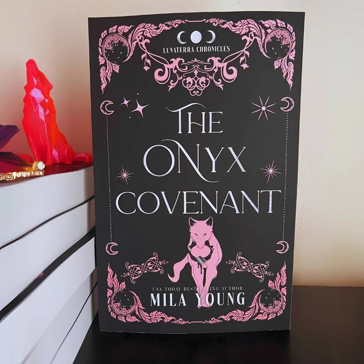 The cover depicts a mysterious scene with a fierce wolf shifter and a woman, hinting at enemies-to-lovers romance, perilous magic, and a blood-soaked ritual in a paranormal fantasy setting