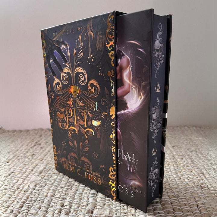 A side view of the hardback book and its collector's box