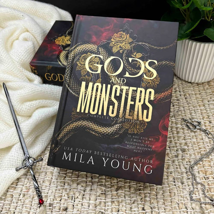 A luxurious gold foiled hardback cover of Gods and Monsters: Special Edition with colourful interior artwork