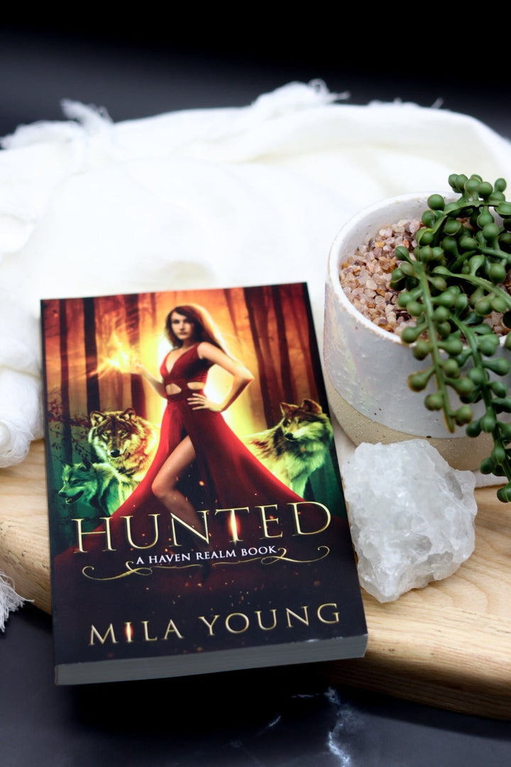 A damaged paperback copy of Hunted from the DAMAGED BOOK (AUS) series showing creases and worn edges