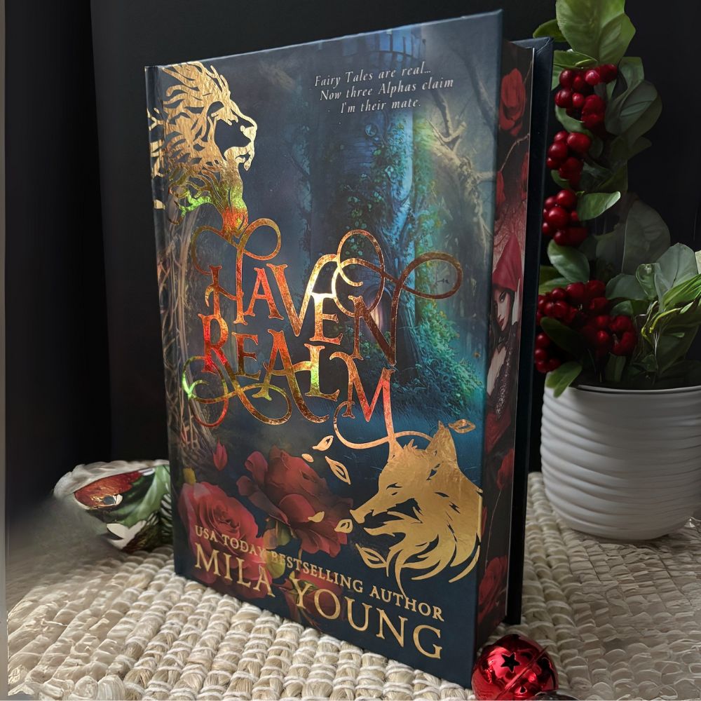 A heavily discounted damaged hardcover of Haven Realm: Special Edition Foil featuring gold foil accents, Little Red Riding Hood edging artwork, interior illustrations, and bonus fairy tale stickers, shipped from the United States